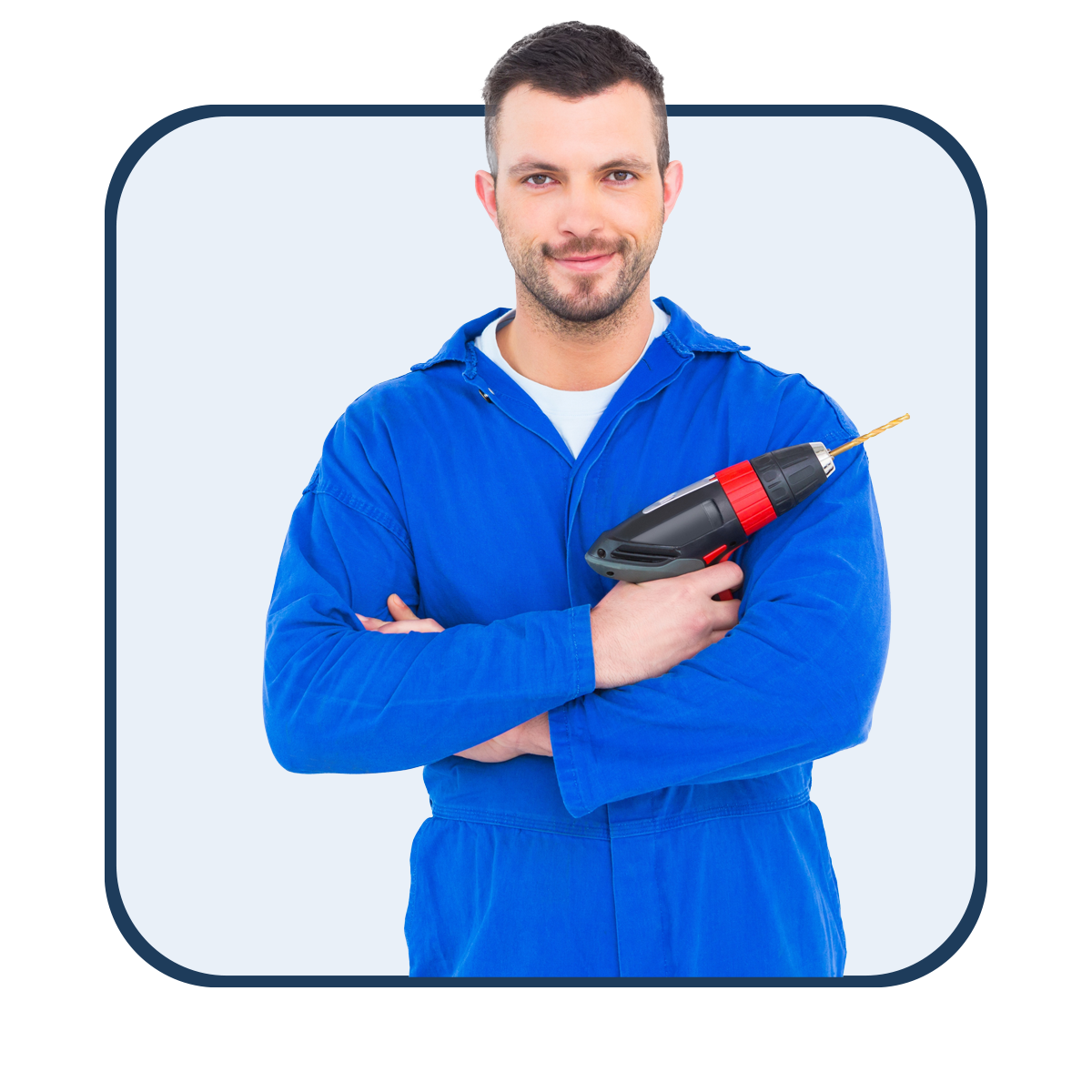 Inbauwerk Berlin Ein Handwerker im Blaumann mit Bohrmaschine